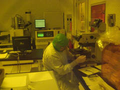 Dima adjusting microscope in stanford clean room